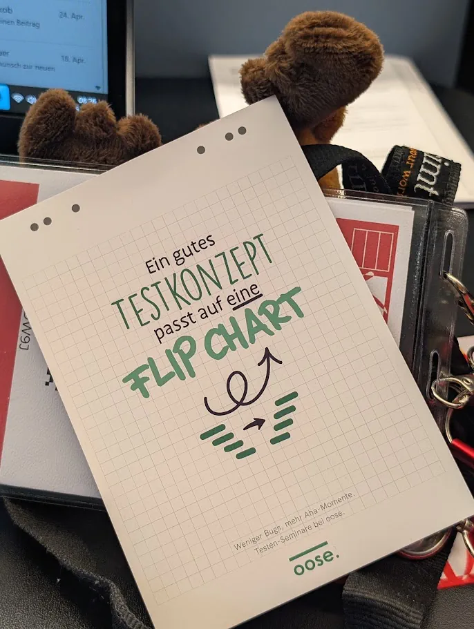 Seminarunterlage mit der Aussage „Ein gutes Testkonzept passt auf eine Flipchart“.